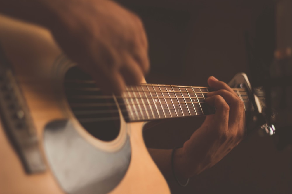 An acoustic guitar ready for the next lesson